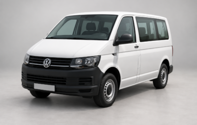 A white passenger Volkswagen Transporter with black bumpers.