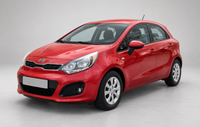 Red hatchback Kia Rio, front and side view on a light background.
